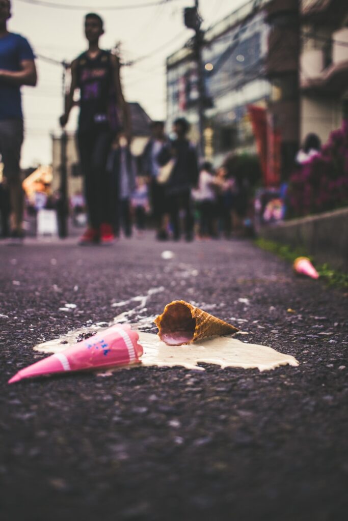 Melted ice cream symbolizing summer anxiety and overwhelm.