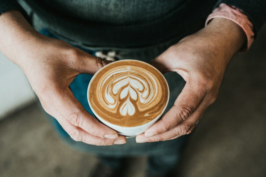 Parent taking a mindful break with coffee, symbolizing self-care during back-to-school anxiety